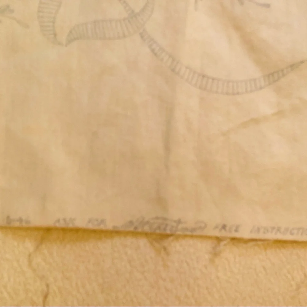 Vintage embroidery muslin, three corners begun, one ink outline blue pink red